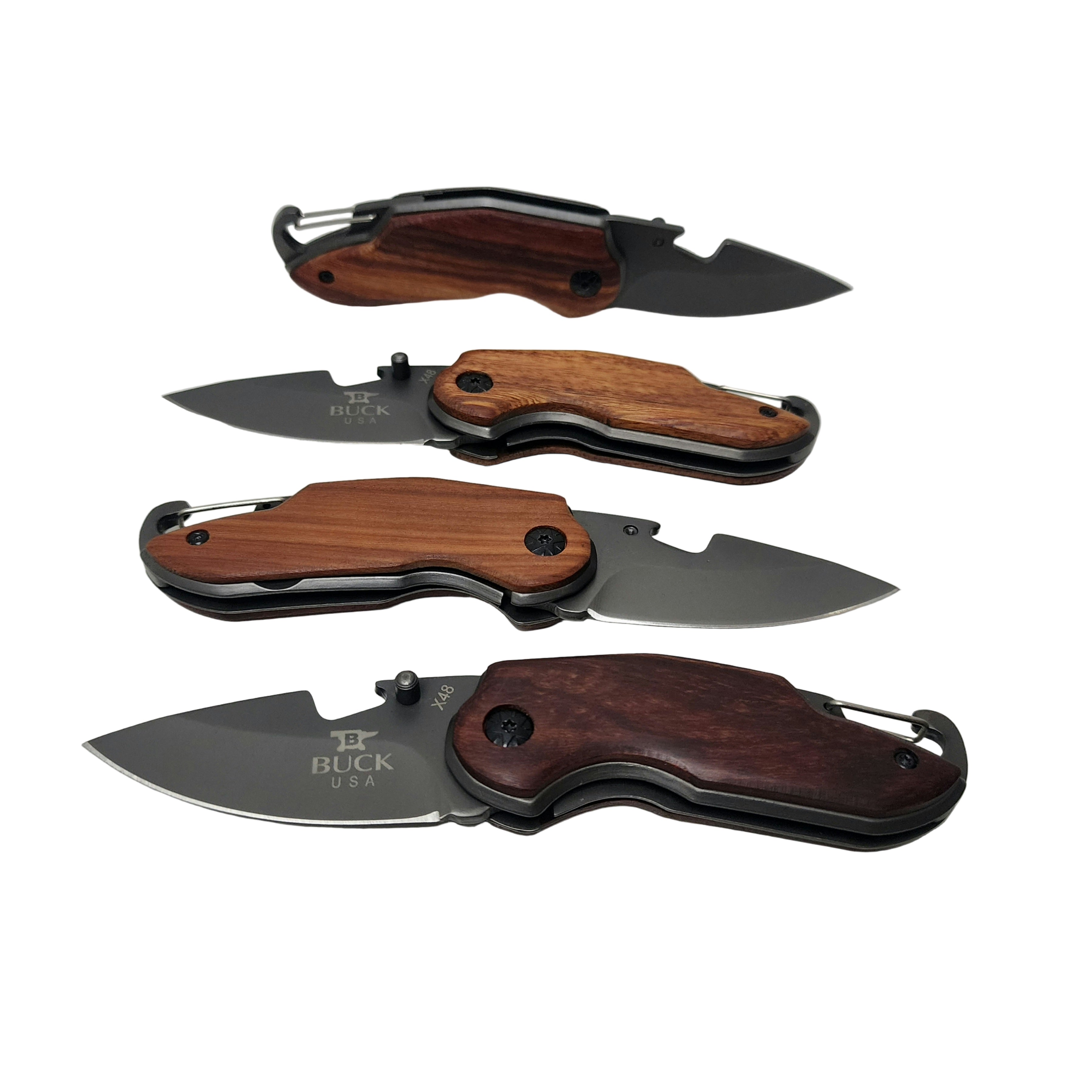 Four folding knives with wooden handles on a light gray background